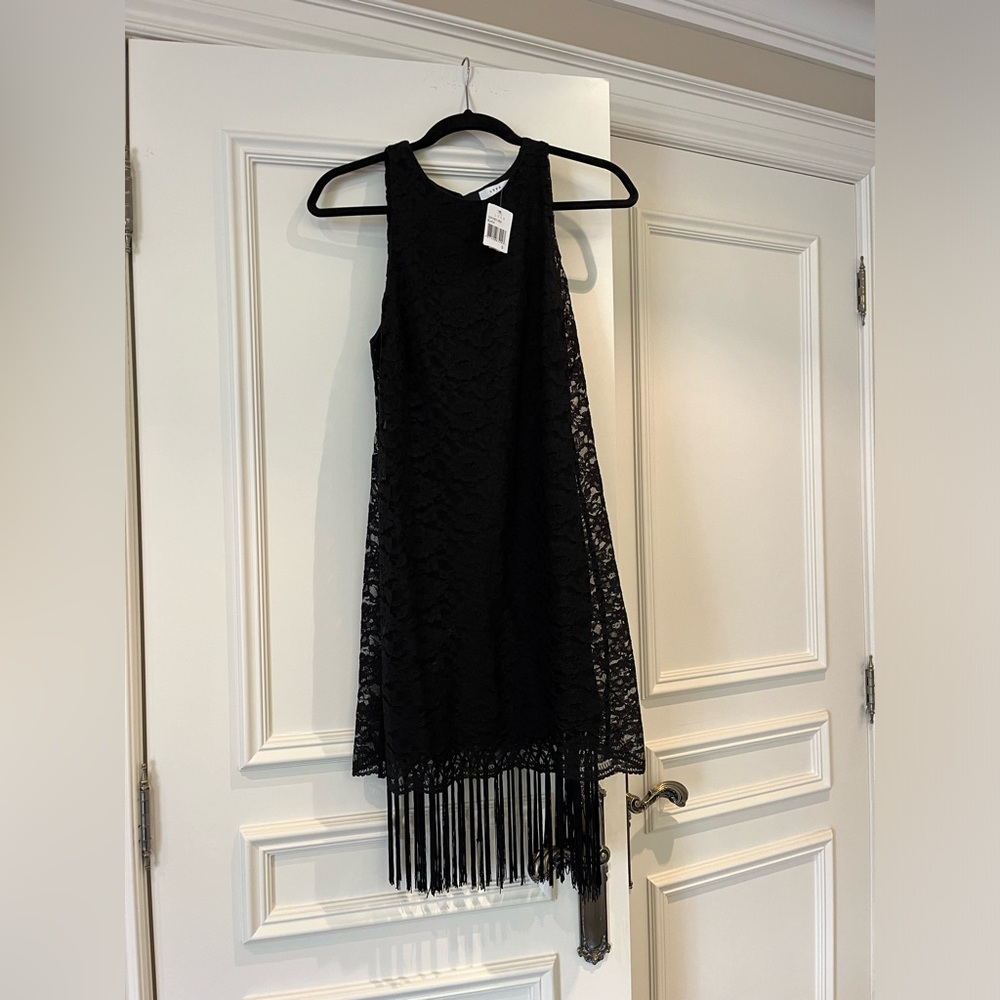 Brand new black lace dress with black lining and fringes